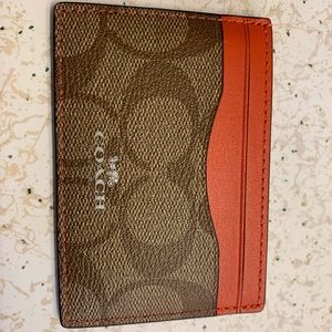 Orange/brown Coach credit card holder